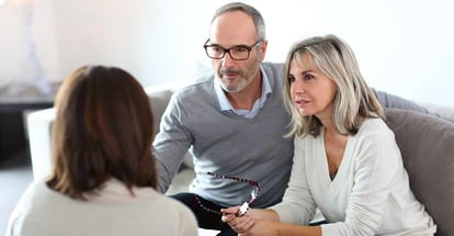 Senior couple meeting financial adviser for investment