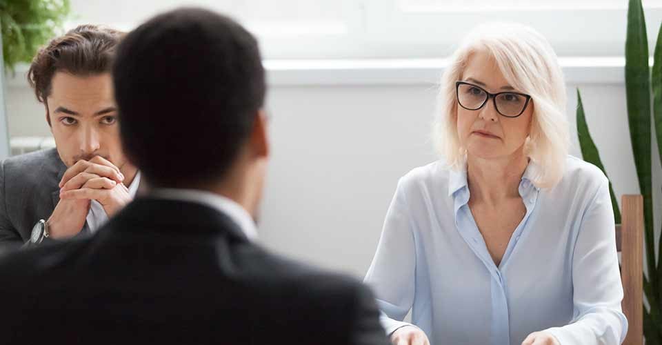 Senior female financial advisor negotiating with a customer
