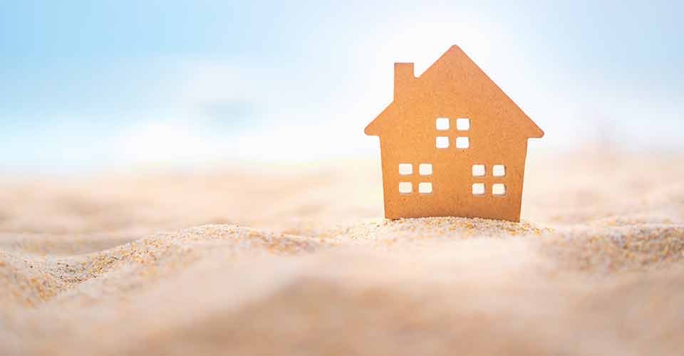 Small home model on sand