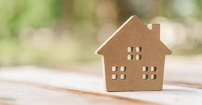 Small home model on wooden table