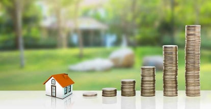 Small house and gold stack coins
