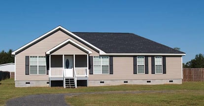 Small low income manufactured home with a covered porch in Florida