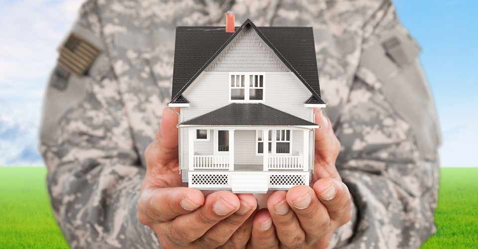 Soldier Holding a Model of House