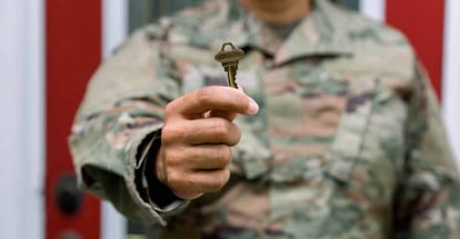 Soldier holding a house key