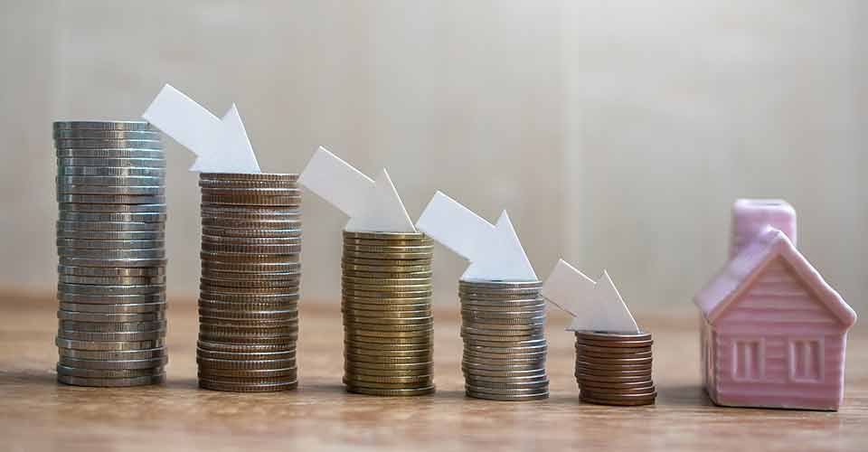 Stack of coins with house model