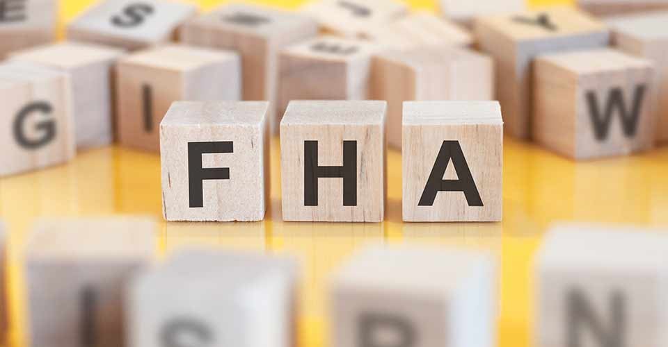 The word FHA is written on a wooden cubes