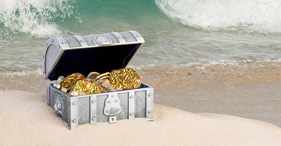 Treasure chest from pirates with gold coins and nuggets