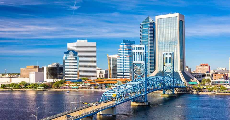 USA downtown skyline at dusk over St Johns River in Jacksonville Florida