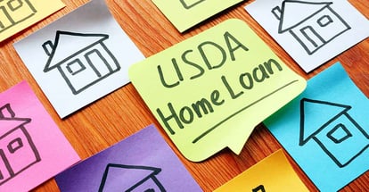 USDA home loan and drawn homes on a paper