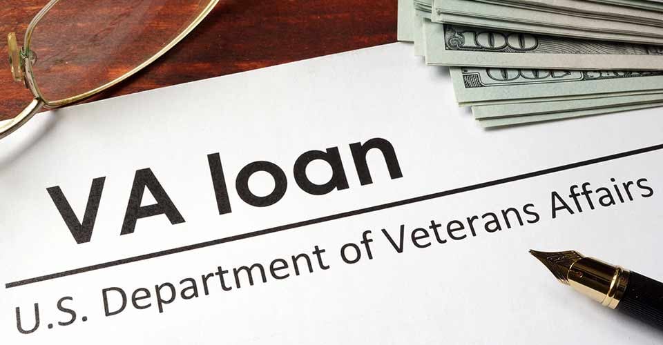 VA loan text on paper and money