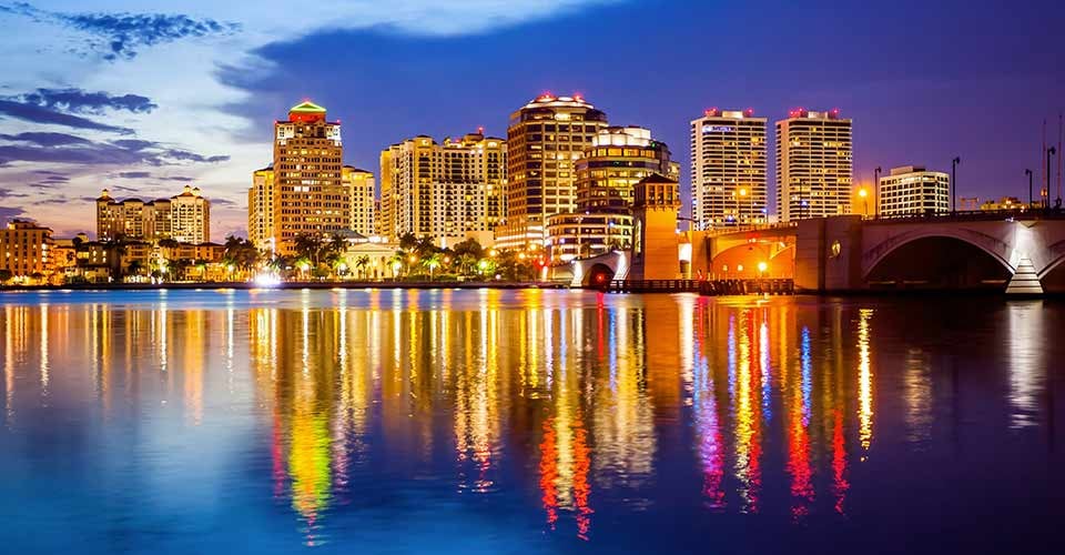 West Palm Beach Florida skyline and city lights as night falls