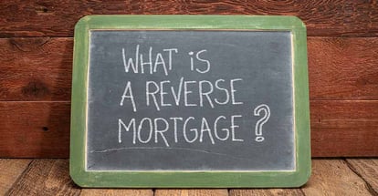 What is a reverse mortgage question written on a blackboard