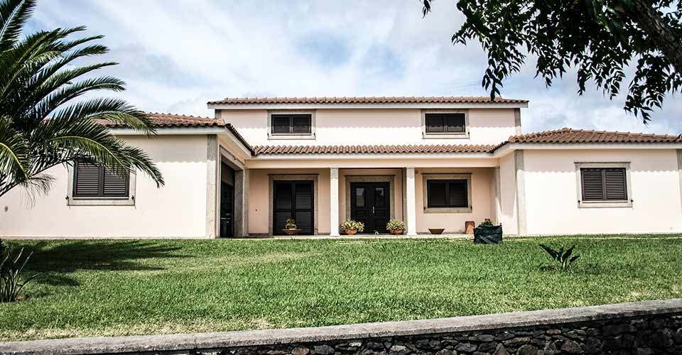 White Concrete House Under Cloudy Sky in Florida