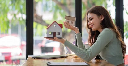 Women looking at model houses for real estate investment