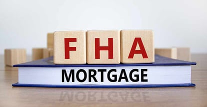 Wooden blocks and book with words FHA mortgage