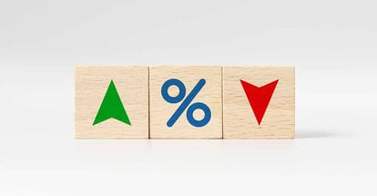 Wooden cube block with icon percentage symbol and arrow