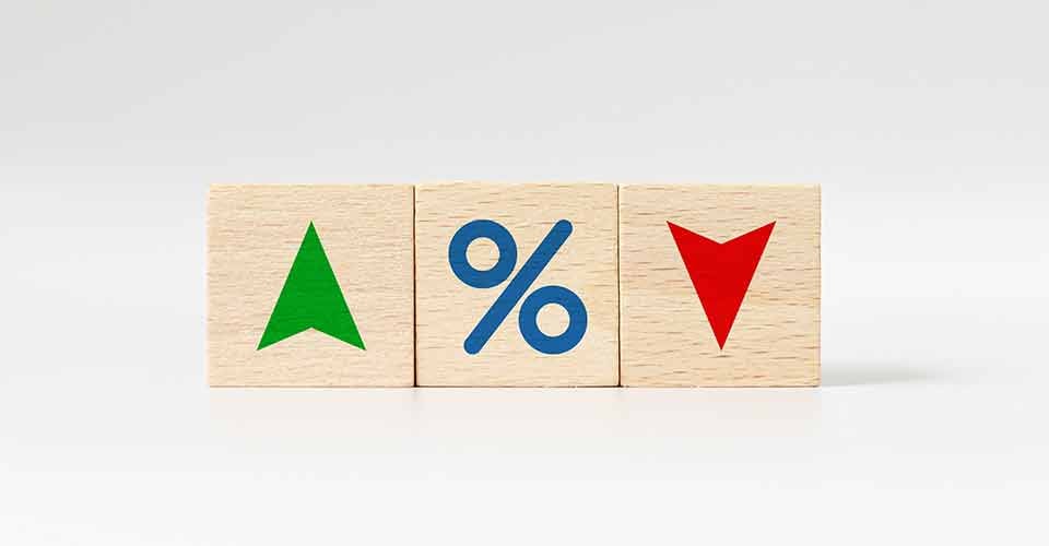 Wooden cube block with icon percentage symbol and arrow