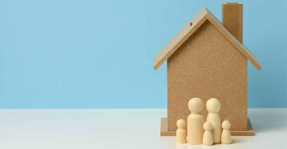Wooden family figurines and model house