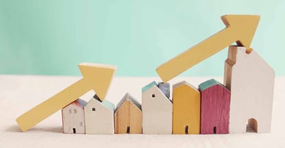 Wooden houses with yellow arrows up