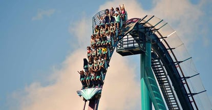 Young people having fun on rollercoaster in Orlando Florida