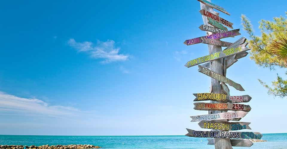 Mileage signpost on key west florida beach