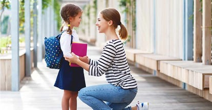 Mother with her little school girl
