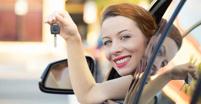Woman showing the new car key