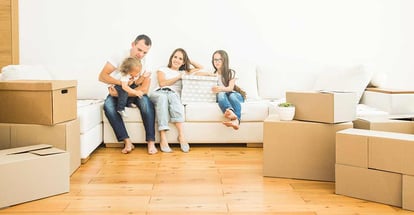 Young family with son and daughter move to a new house