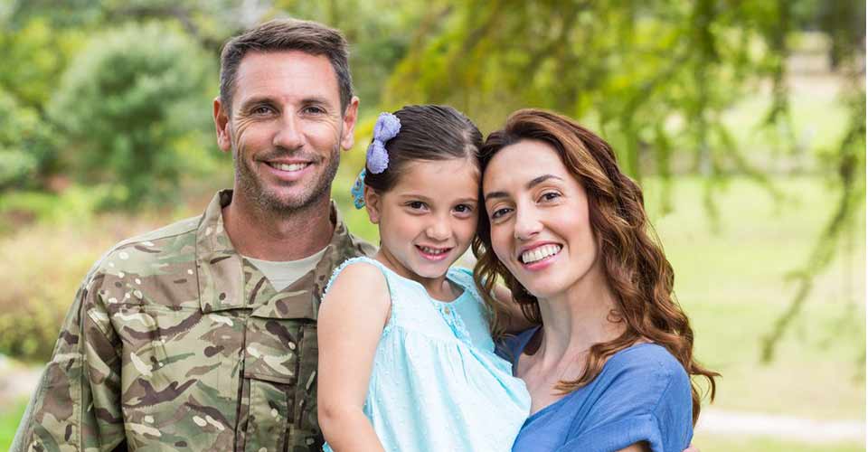 Handsome soldier reunited with family on a sunny day