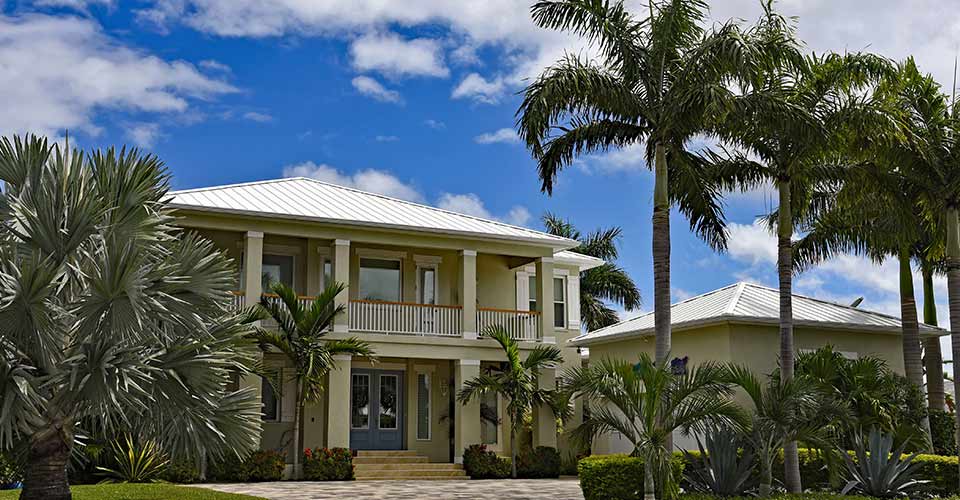 Large New Beach House in Florida with Palm Trees and Landscaping