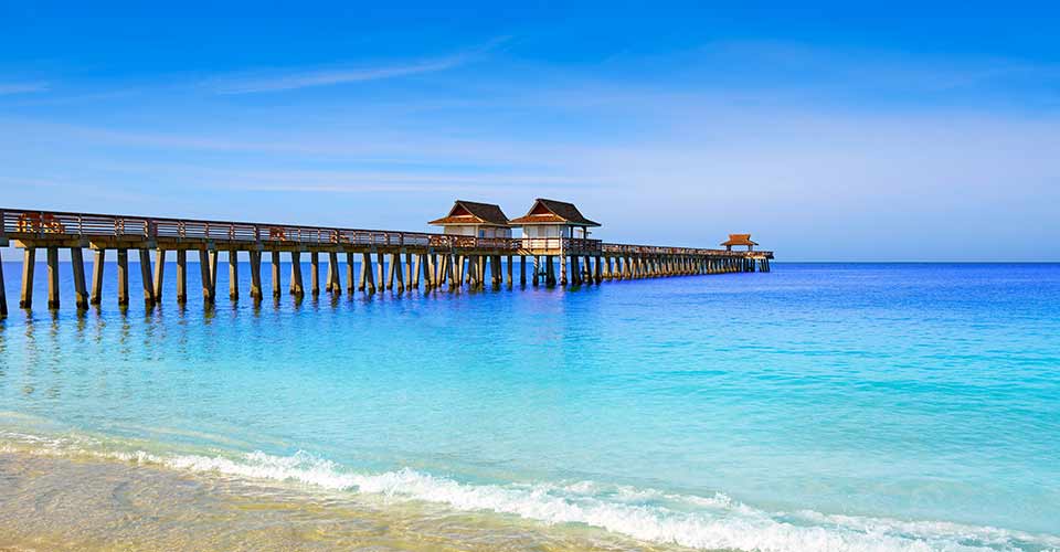 Naples Pier and beach on a sunny day in Florida