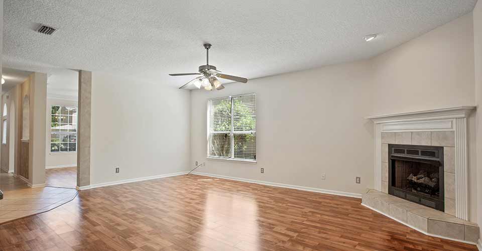 Vacant living room with laminate wood floors