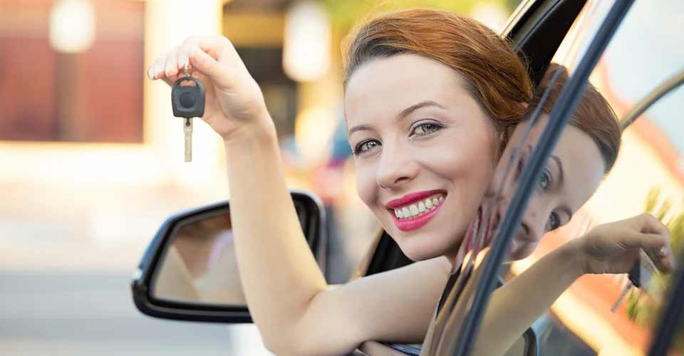 Woman showing the new car key